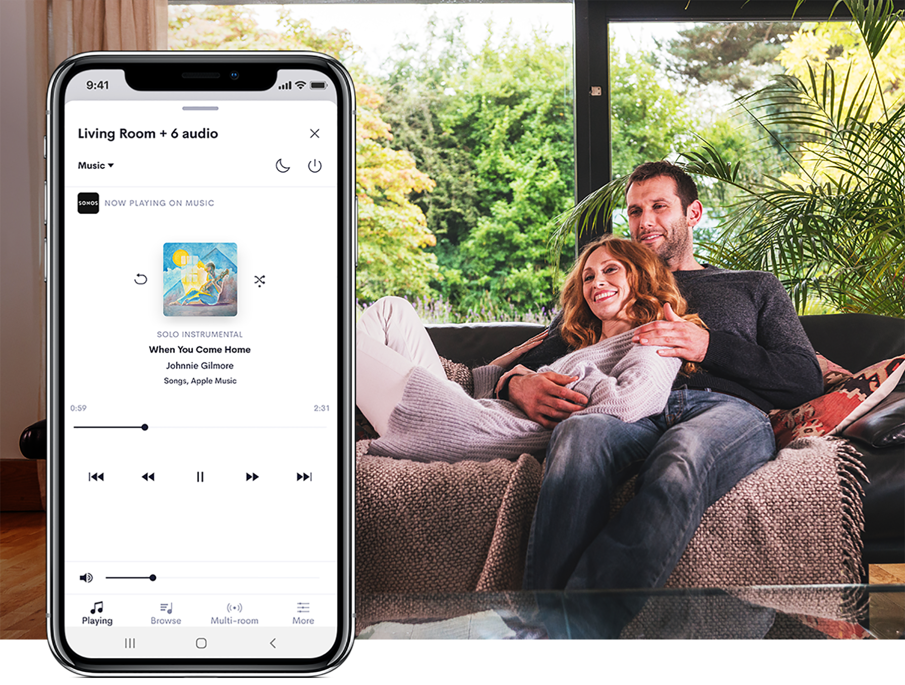 Couple in living room with image of smart phone with audio UI